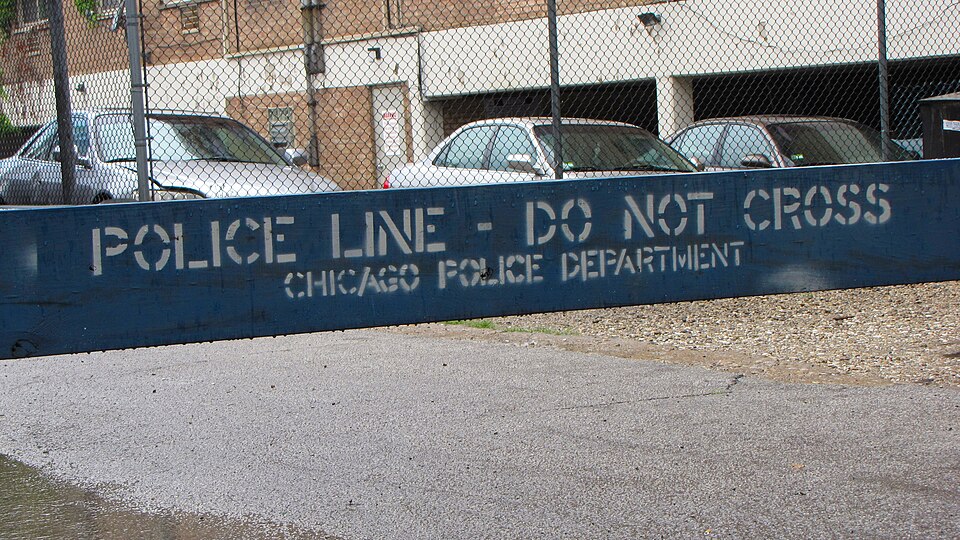 Police barrier at the Glenwood Sunday Market in Chicago's Rogers Park neighborhood.

Ben Schumin is a professional photographer who captures the intricacies of daily life.  This image may be used under Creative Commons Attribution-ShareAlike 2.0.  Please provide artist attribution, as well as a link