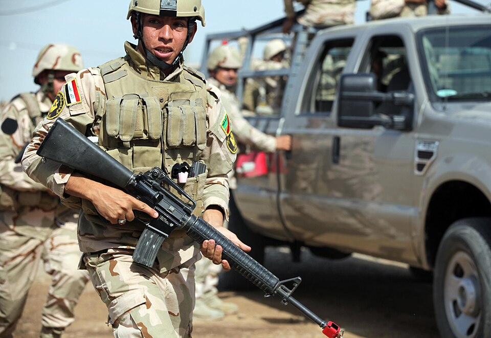 CAMP TAJI - An Iraqi soldier with the 34th Armored Brigade provides security during personal security detail training at Camp Taji, Iraq, July 26, 2016. Task Group Taji instructors conducted personal security detail training to supplement the Iraqi soldiers’ overall tactical capabilities. Training a
