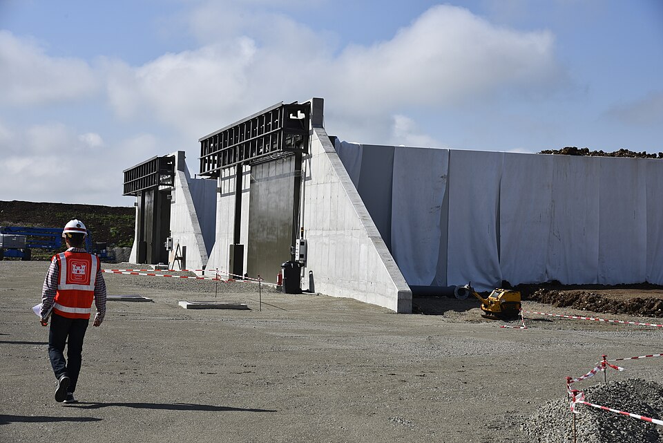 U.S. Army Corps of Engineers, Europe District Project Engineer 1st Lt. Quinn Gutierrez checks out progress on munitions storage facilities under construction at Campia Turzii Air Base, Romania during a site visit June 21, 2021. The U.S. Army Corps of Engineers is managing a growing construction miss