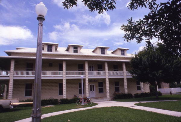 Local call number: COM08583
Title: New River Inn: Fort Lauderdale, Florida
Date: ca. 1975
General note: A nearby historical marker reads, "Old Fort Lauderdale Village at the intersection of the New River and the Florida East Coast Railway (F.E.C.) incorporates four turn-of-the-20th century historic 