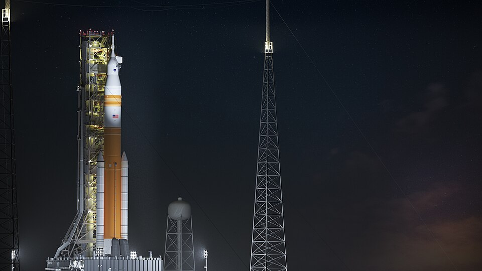 Illustration of nighttime scene of the evolved SLS Block 1B Crew variant on Pad 39B.. This configuration of the rocket, with the Exploration Upper Stage, will provide in-space propulsion to send astronauts in NASA’s Orion spacecraft and heavy cargo on a precise trajectory to the Moon. The evolution 