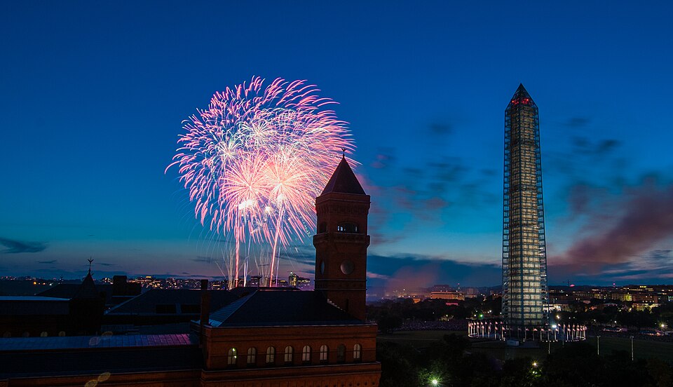 4th of July fireworks as seen from the U.S. Department of Agriculture (USDA) headquarters building, with the USDA Forest Service Yates Building in the foreground, left, and the Washington Monument in Washington, D.C., on July 4, 2013. USDA photo by Lance Cheung.