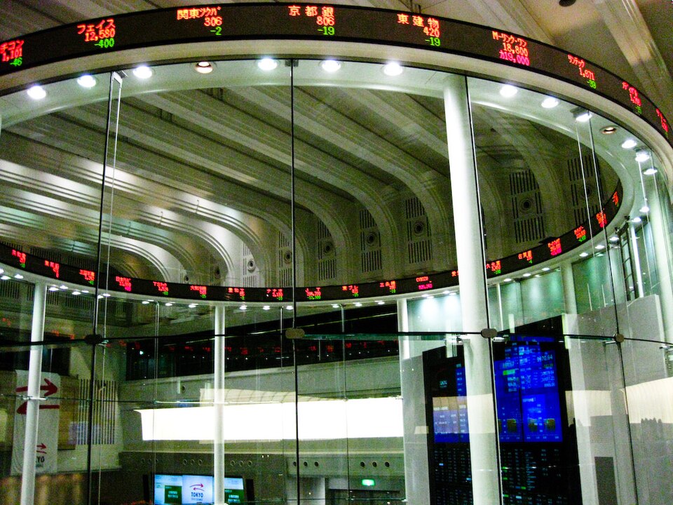Tokyo Stock Exchange's so-called Market Center. The real stock trading floor closed in 1999. In its place is now just a glass cylinder, a few screens and a silly ticker—something for clueless journalists to shoot when reporting on Japan's economy and stock market.