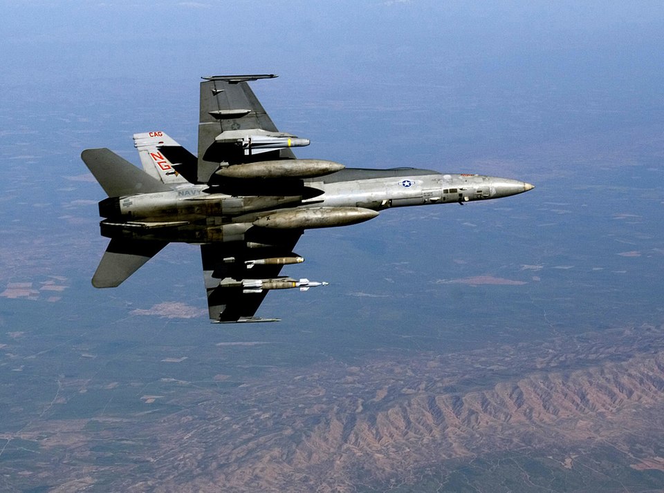 Iraq (Mar. 27, 2005) - An F/A-18C Hornet, assigned to the "Argonauts" of Strike Fighter Squadron One Four Seven (VFA-147), rolls into a turn while flying a combat mission over Iraq. The Carl Vinson Carrier Strike Group is conducting operations in support of multi-national forces in Iraq and maritime