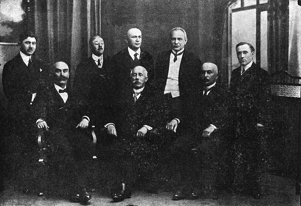Members of the Cernăuți Court of Appeal (Curtea de Apel Cernăuți) at its foundation in mid-1919. From left to right, names and positions taken from the source:Top: Dimitrie C. Bagdad, Temistocle Bocancea, Dr. Corneliu Gheorghian  (Counselor), Dr. Nicolae Țurcan, Dr. Aureliu CăpăținăBottom: Dr. Vasil