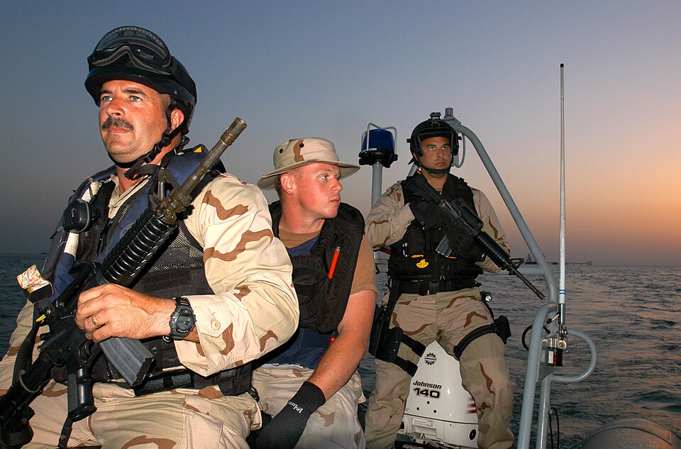 040505-C-7087B-003.jpgNORTH ARABIAN GULF (MAY 5, 2004)-U.S. Coast Guard Chief Petty Officer John Whelan, 42, from Massapequa, N.Y. (L); U.S. Navy EN2 Josh Martin, 23, from Chippewa Falls, Wis.; and U.S. Coast Guard Machinery Technician 3rd Class Mike Azevedo, 22, from Miami, Fla., remain vigilant wh