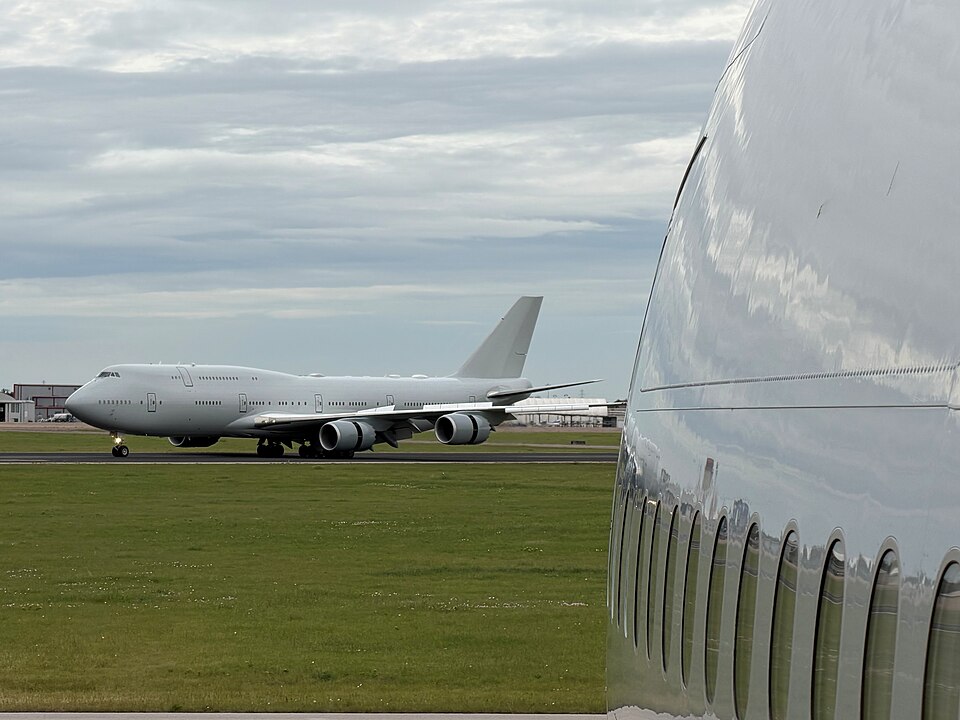A VC-25B Bridge aircraft taxis on a runway after landing at Waco, Texas. The aircraft recently completed modification and flight-testing phases, entering maintenance to be painted in red, white, gold and blue livery. The program remains on schedule to deliver the Bridge aircraft to the Presidential 
