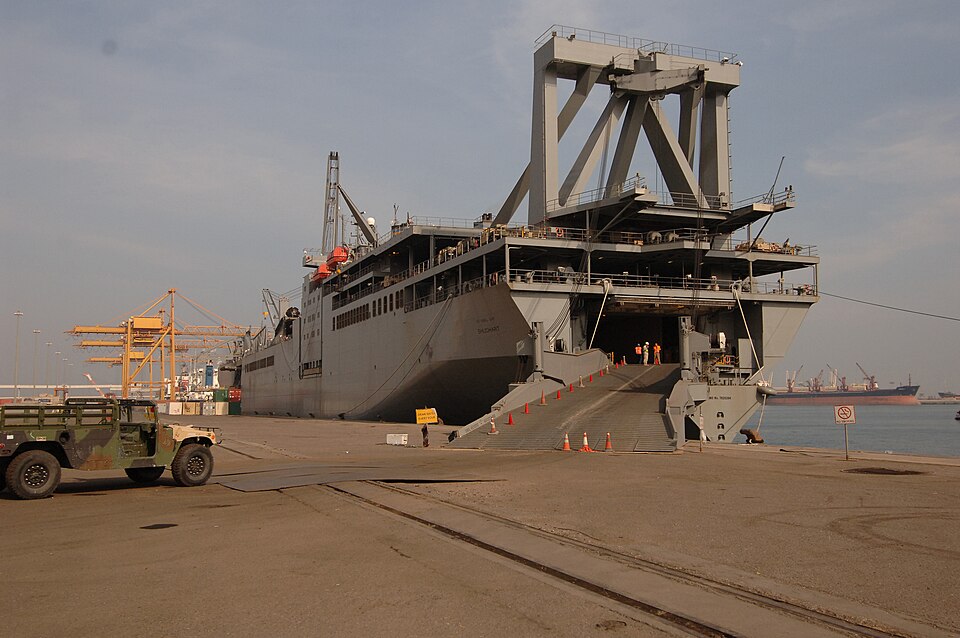 Kuwait (Dec. 15, 2006) - After passing a customs inspection, an Army M114 Hummer is parked in front of the Military Sealift Command roll-on/roll-off ship USNS Shughart (T-AKR 295) before Navy cargo handlers with NAVELSG Port Group Echo loads it aboard in Kuwait. NAVELSG Port Group Echo was mobilized