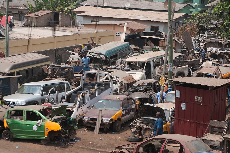 A car repair shop with some abandoned Vehicles