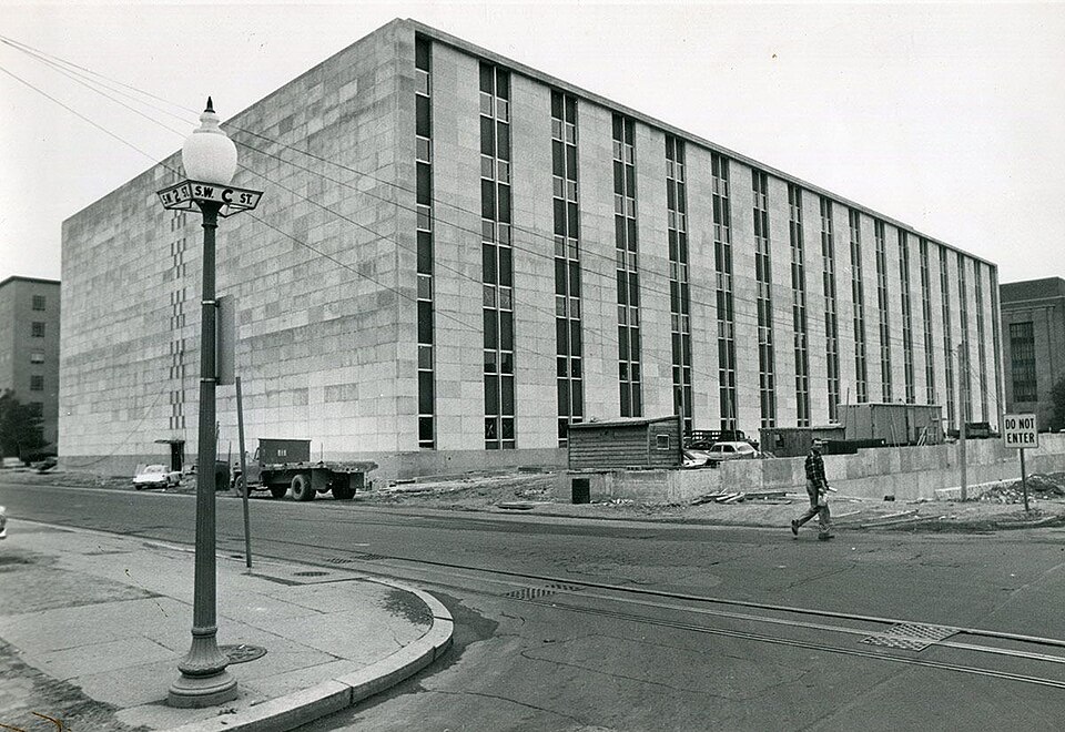 Federal Office Building No. 8 was the Food and Drug Administration's (FDA) first modern home, built solely for its use. Over two thirds of the building housed working laboratory space, while offices filled in the rest.  The photo shows the building under original construction in the early 1960s.  It