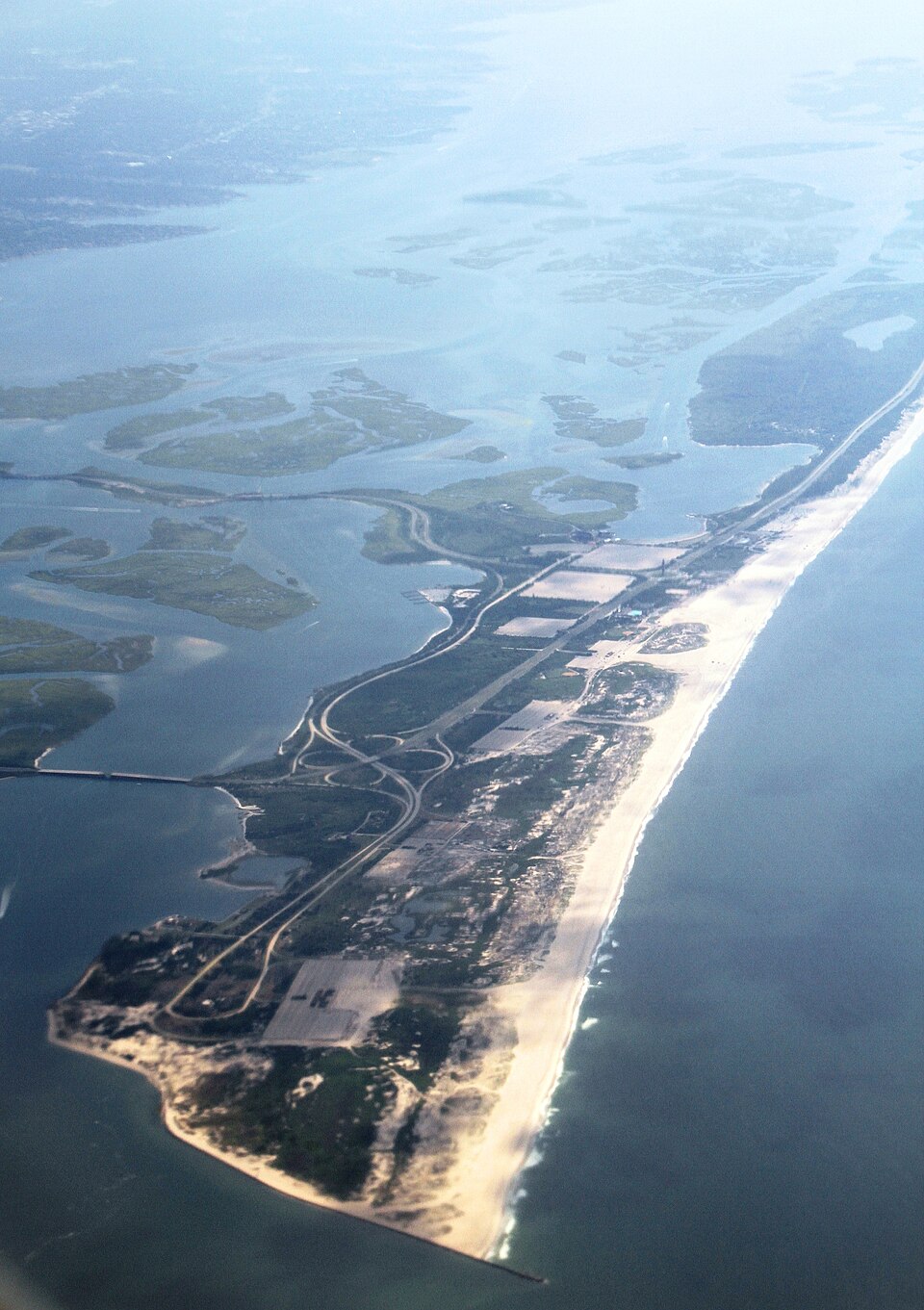 Aerial view from the coastal area of western Long island, New York. At the tip of the peninsula is a US Coast Guard station.