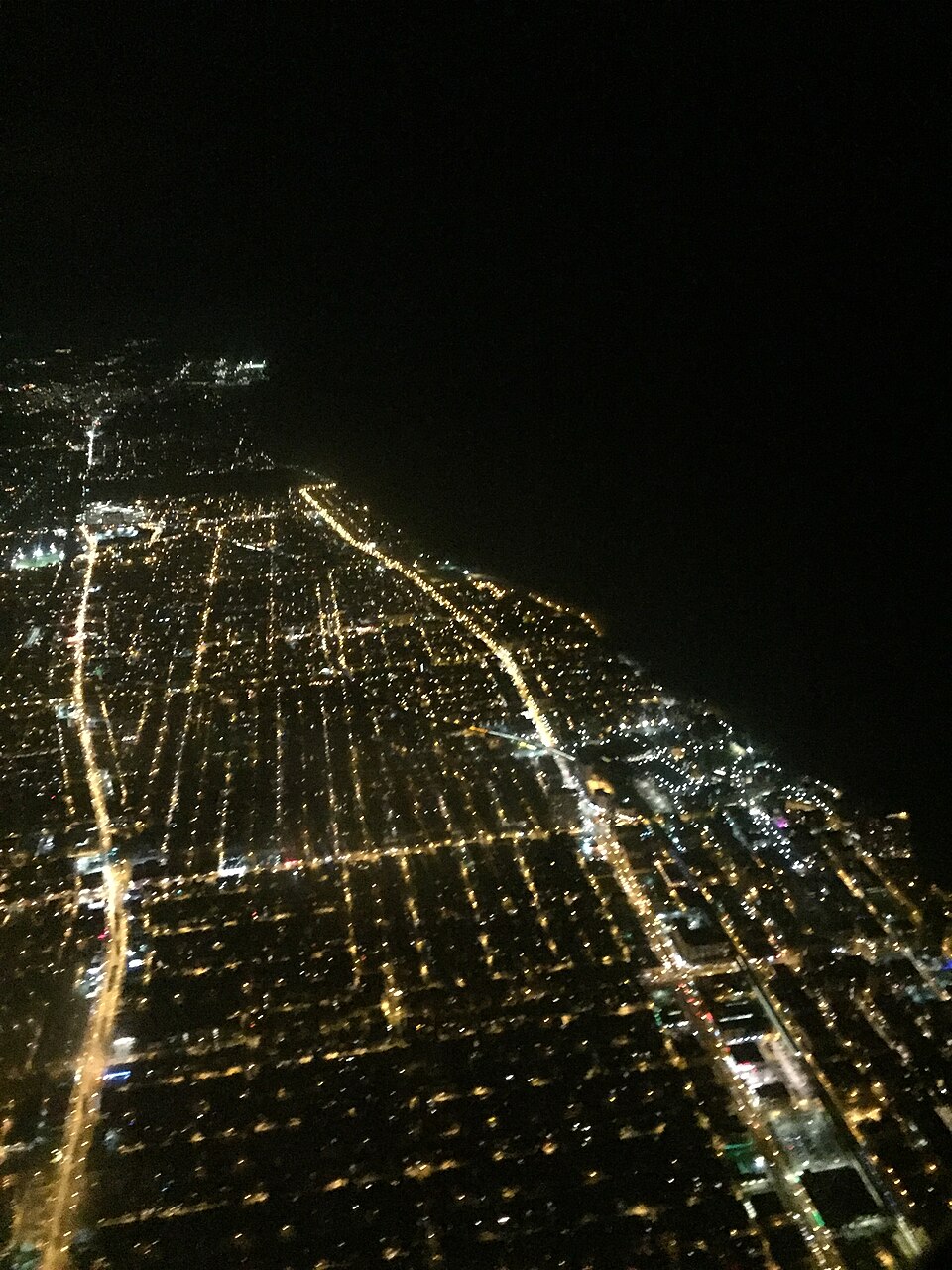 Airplane view of the lakeshore of the Chicago neighborhoods of Edgewater and Rodgers Park, and the suburb of Evanston. Included in this view are the campuses of Loyola University and Northwestern University.