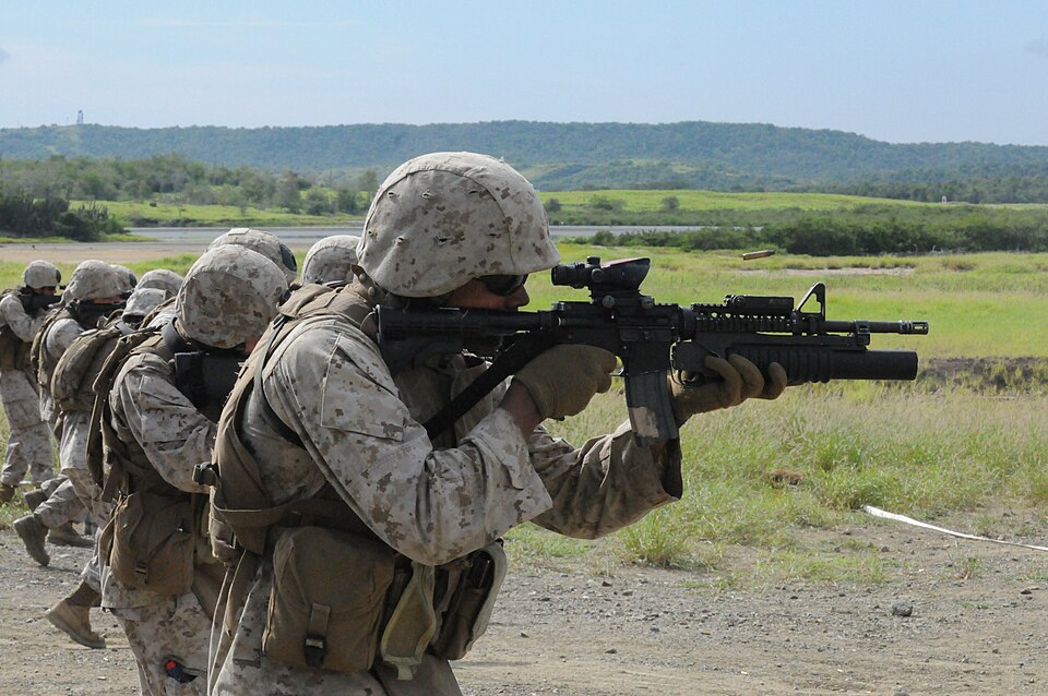Marines from the Marine Corps Security Forces Company fire their weapons at the Grenadillo Range, Oct. 19. MCSFC provides perimeter security for Naval Station Guantanamo Bay and Joint Task Force Guantanamo. JTF Guantanamo provides safe, humane, legal and transparent care and custody of detainees, in