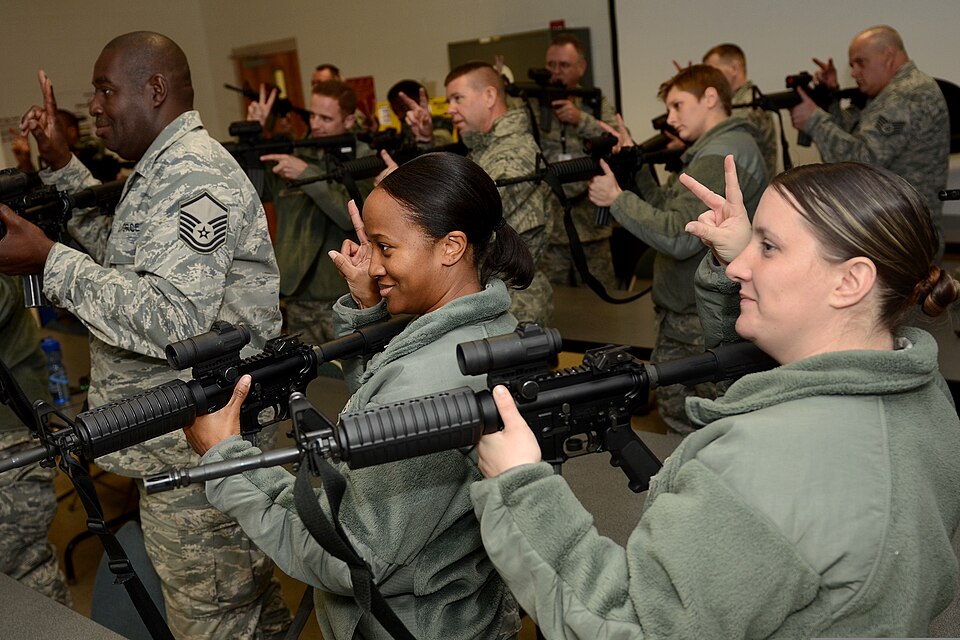 U.S. Airmen with the 169th Fighter Wing, South Carolina Air National Guard participate in the classroom portion of M4 carbine qualification training at McEntire Joint National Guard Base, S.C., Dec. 8, 2013. Airmen assigned to the unit were preparing to deploy to Southwest Asia.