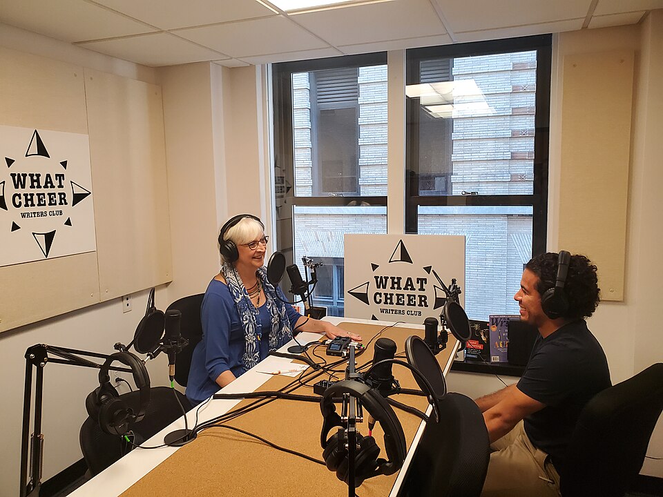 Podcasting studio in What Cheer Writers Club in Providence, Rhode Island, including microphones, recording equipment, interviewer and interviewee.