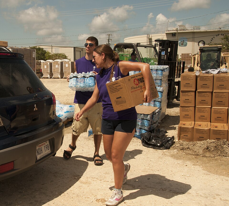 The original database describes this as: Title: Faith based groups assist emergency food distribution center operations Production Date: 09/02/2012 Caption: Slidell, La. , Sep. 2, 2012 --Members of Convoy of Hope helps distribute ice, food and water to residents in Slidell, La, who were affected by 