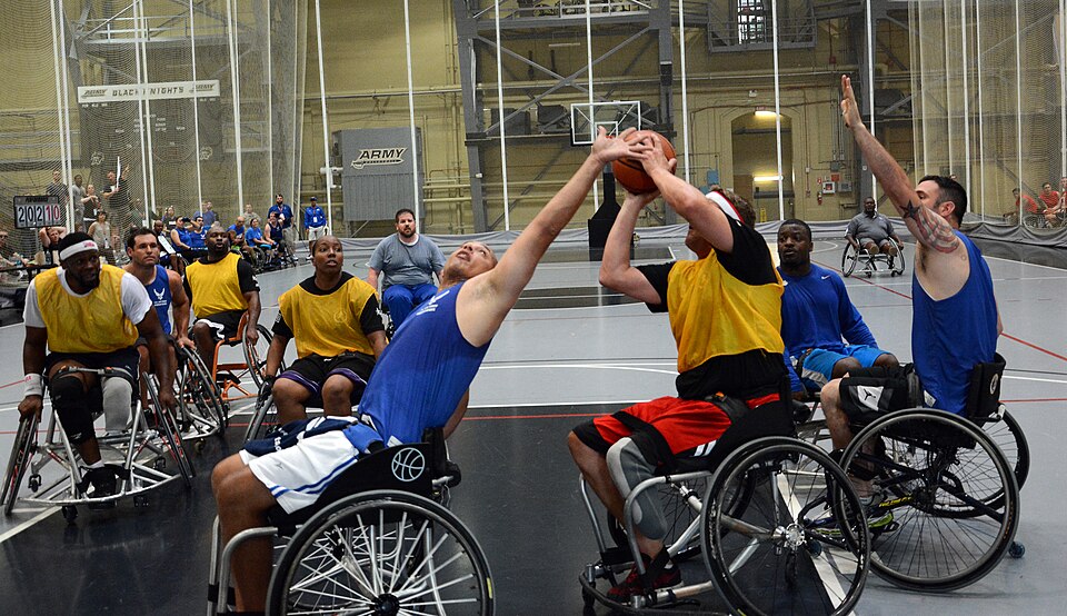 Master Sgt. Daniel Hendrix, Fort Carson, Colo., wins the battle for the ball during the game opener of Wheelchair Basketball competition June 16 at the 2014 U.S. Army Warrior Trials. Team Army took the win over the Air Force team at West Point, N.Y.  where more than 100 wounded, ill and injured Army