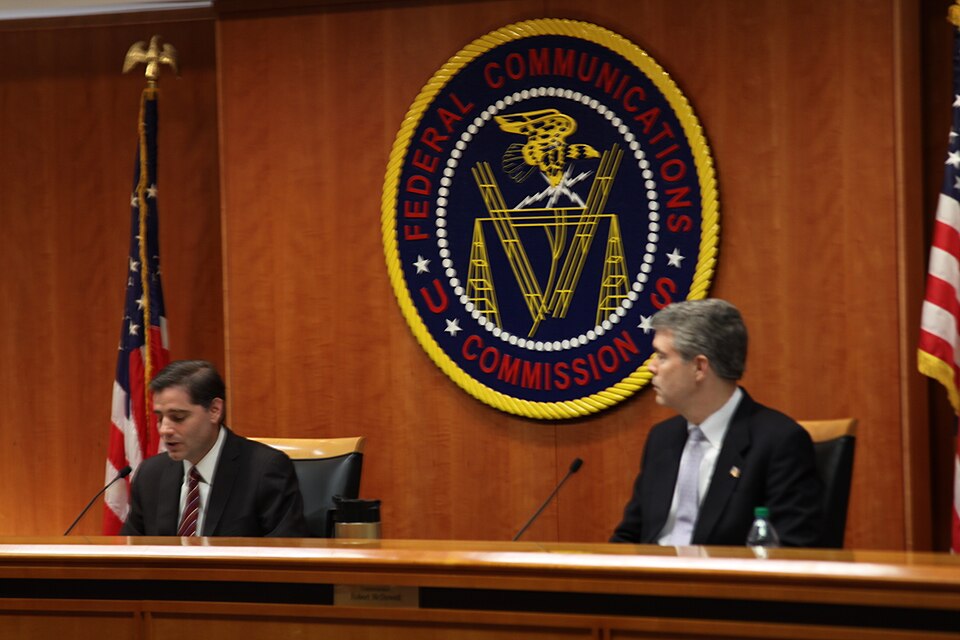 Chairman Julius Genachowski and Commissioner Robert M. McDowell at the July 2011 Open Commission Meeting  on Low Power Radio Service, Cramming, and Wireless E911 Location Information
