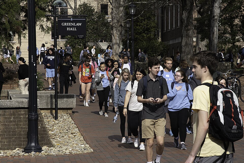 Students at UNC-Chapel Hill walk through campus between classes