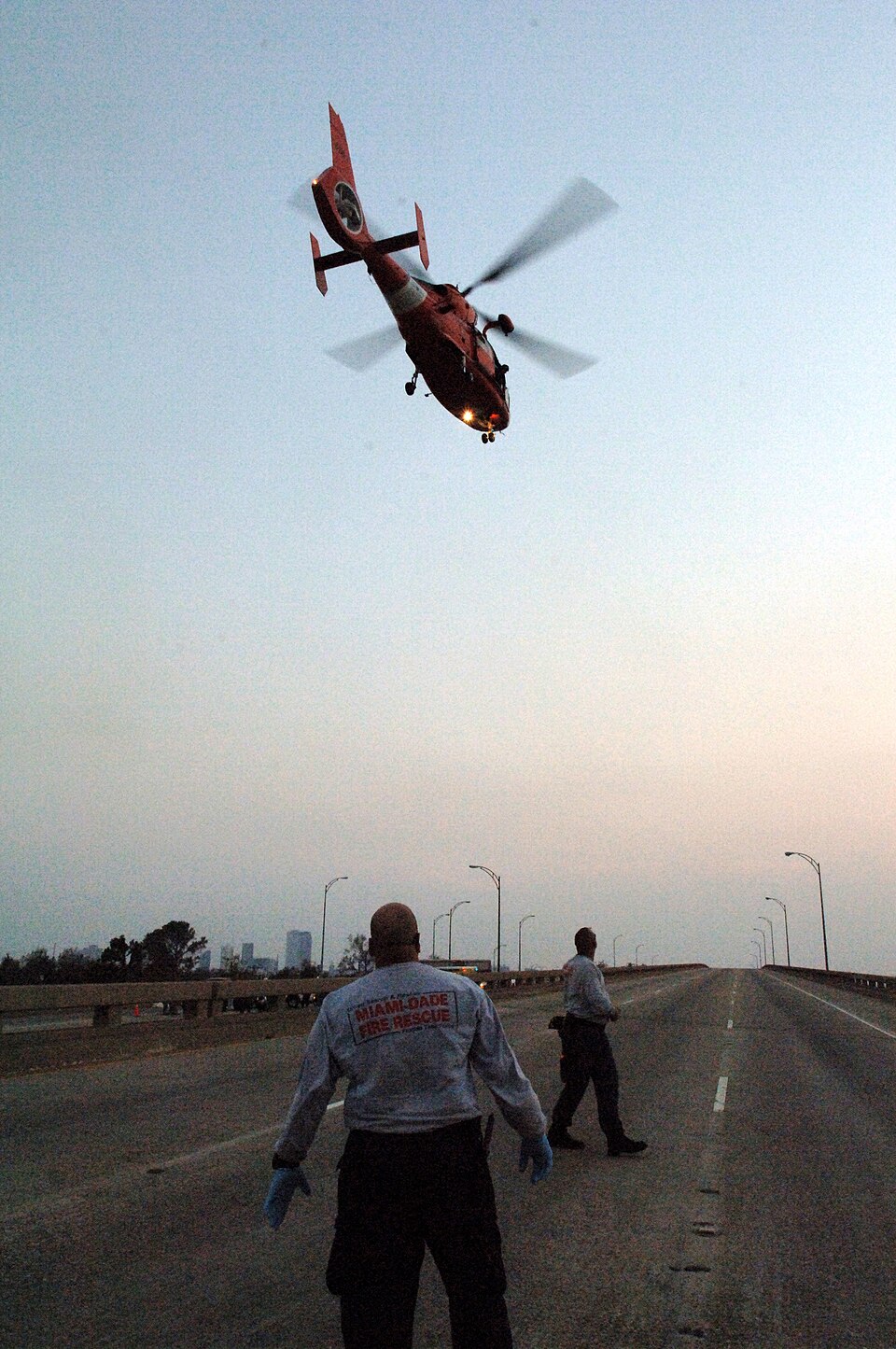 New Orleans, LA, September 3, 2005 -- FEMA Urban Search and Rescue workers watch a helicopter leave 