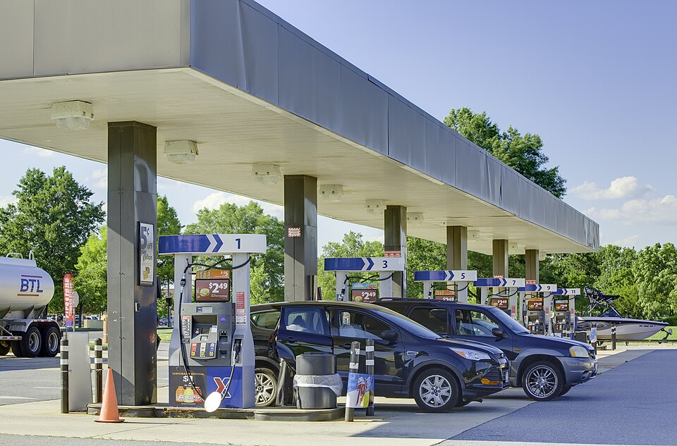 Customers of Joint Base Anacostia-Bolling's Exchange Express gas station fill their tanks during the
