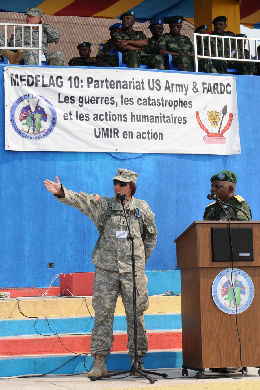 1st Lt. Coty Sicble, a health administrator with the North Dakota National Guard's 814th Army Support Medical Company based in Bismarck, gives a step-by-step narration to the audience at the simulated mass casualty exercise, Sept. 17 in Kinshasa, Democratic Republic of the Congo.  
U.S. Army photo b