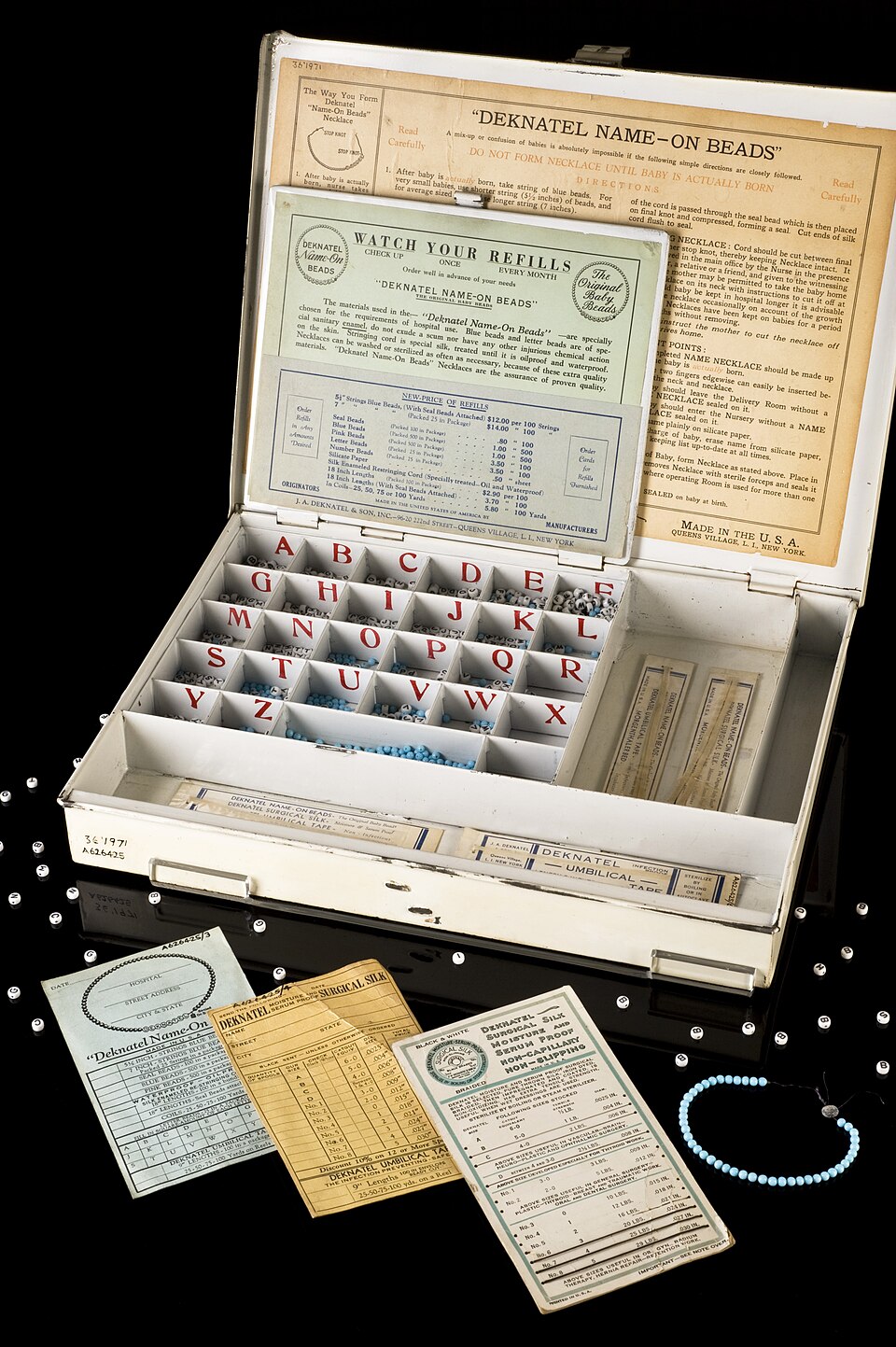 Ensuring and then maintaining the correct identification of a new born infant within the often busy and crowded environment of a hospital is essential. This infant identification kit was manufactured by J A Deknatel &amp; Son Inc in New York. &amp;#145;Deknatel Name-On Beads&amp;#146; were used in m