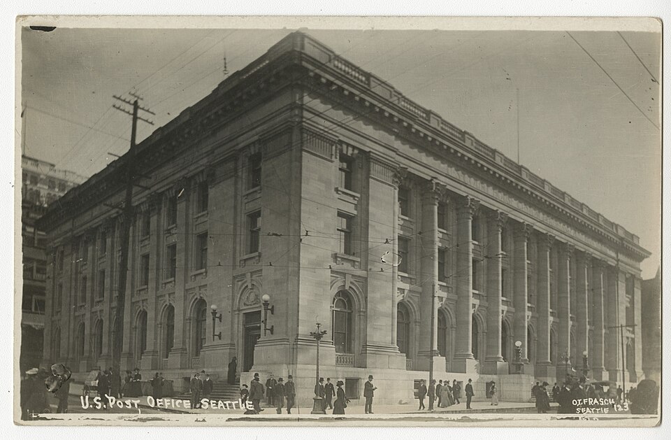 Street view of the Federal building in downtown Seattle (also known as the U.S. Court House, Custom House and Post Office). Construction on the Federal Building began in 1903 and ended in 1908. The building was located at the intersection of Union Street and Third Avenue, which was being regraded at