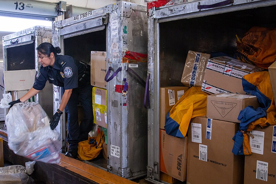Customs and Border Protection officers assigned to the Area Port of Jacksonville, Florida perform consignment inspections of foreign packages arriving to the United States on Feb. 20. Photo by Ozzy Trevino, U.S. Customs and Border Protection