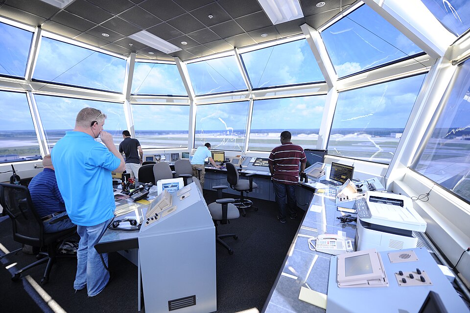 Air traffic controllers direct air and ground operations atop the new air traffic control tower June 11, 2013, at Pope Field, N.C. The new tower is Leadership in Energy and Environmental Design, or LEED, certified, stands 11-stories tall and boasts more than 9,000 square feet of internal space. (U.S