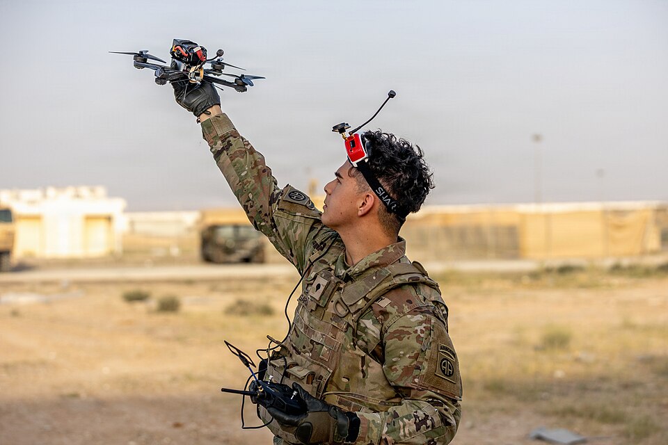 A U.S. Army paratrooper prepares to launch an unmanned aerial system (UAS) in the Middle East during a routine training event. Small UAS platforms provide units with real-time aerial observation capabilities that assist with reconnaissance, security, and terrain analysis. (U.S. Army photo)