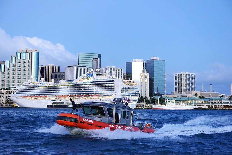 Crew members aboard a 25-foot Response Boat-Small from Maritime Safety and Security Team 91107 escort the cruise ship Pride of America out of Honolulu Harbor, Oct. 3, 2015. The Coast Guard conducts escorts of high-capacity passenger vessels to ensure security of the passengers, the vessel and the po