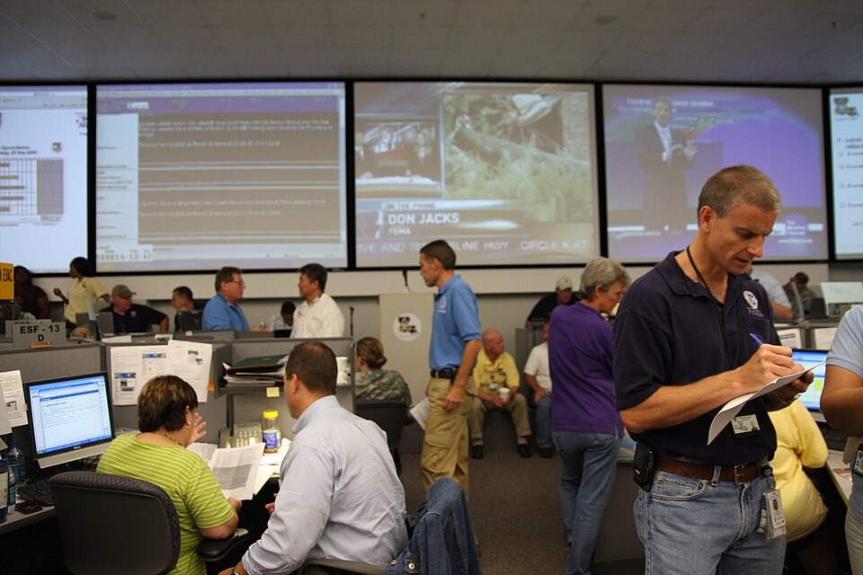 Baton Rouge, LA, September 3, 2008 -- FEMA employee in the EOC, writes new information on a pad of paper, during disaster recovery efforts for Hurricane Gustav. Jacinta Quesada/FEMA