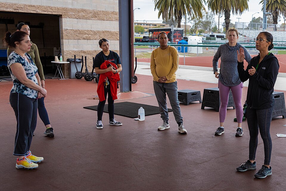 U.S. Navy Lt. Cmdr. Ashlyn Lobenberg, a psychologist with 1st Medical Battalion, 1st Marine Logistics Group, explains the importance of mental health during and after pregnancy during the Artemis Program physical training at Camp Pendleton, California, Feb. 14, 2023. Artemis is a Navy medicine and r