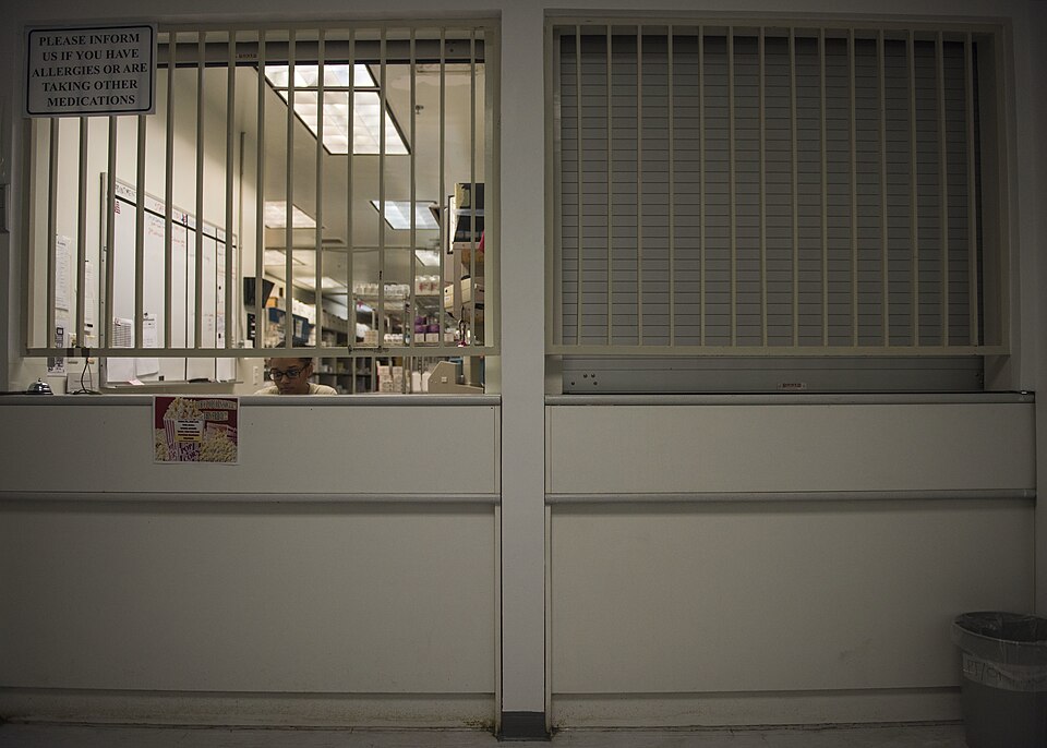 Senior Airman Latoya Kirven, 455th Expeditionary Medical Group pharmacy technician, attends the pharmacy window at Craig Joint-Theater Hospital, Bagram Airfield, Afghanistan, June 06, 2016. The pharmacy will soon be opening an over-the-counter program so servicemembers can get medication without see