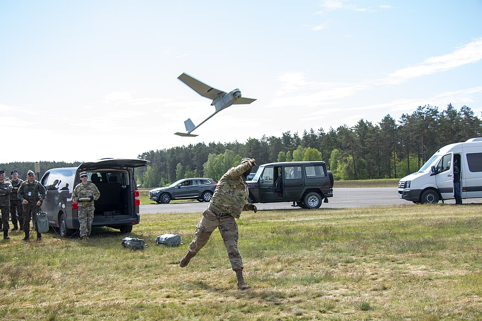Spc. Mitchel Horlocker, a 12T Technical Engineer with 9th Brigade Engineer Battalion, 2nd Armored Brigade Combat Team, 3rd Infantry Division, launches the AeroVironment RQ-11 Raven during a demonstration to Polish military officials May 22, at Ziemsko Drawsko Pomorskie Training Area, Poland. The Rav