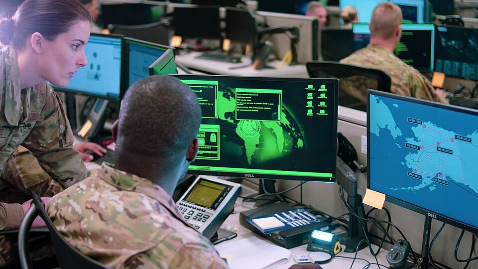 Capt. Sarah Miller and Tech. Sgt. Carrol Brewster, discuss options in response to a staged cyber-attack during filming of a scene for an Air Force Reserve Command mission video at Joint Base San Antonio-Lackland, Texas, on June 1, 2019. The video, which is currently in production, will also be filme