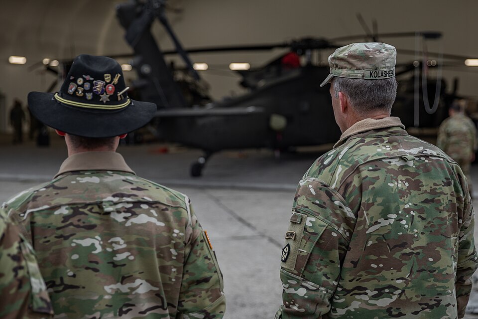 U.S. Army Lt. Col. Chad Monroe, left, commander of the 3rd Squadron, 6th Cavalry Regiment, briefs, Lt. Gen. John S. Kolasheski, commander of V Corps, on the aircraft maintenance hangars at 33rd Air Base in Powidz, Poland, Nov. 17, 2022. The V Corps commander received a tour to assess the Powidz airf
