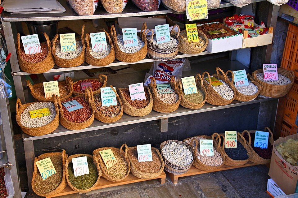Beans and other legume varieties (including lentils) - price tags at a grocery store in Granada, Spain.
