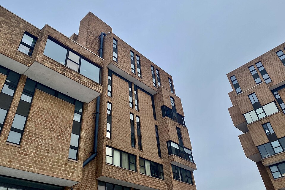 The Brutalist architecture of UB North Campus's Ellicott Complex, as seen from the loop just off the Richmond B parking lot on a February 2022 afternoon. Affectionately known as "Legoland" among the student body, the obvious influence behind the breathtaking design of this enormous interconnected me