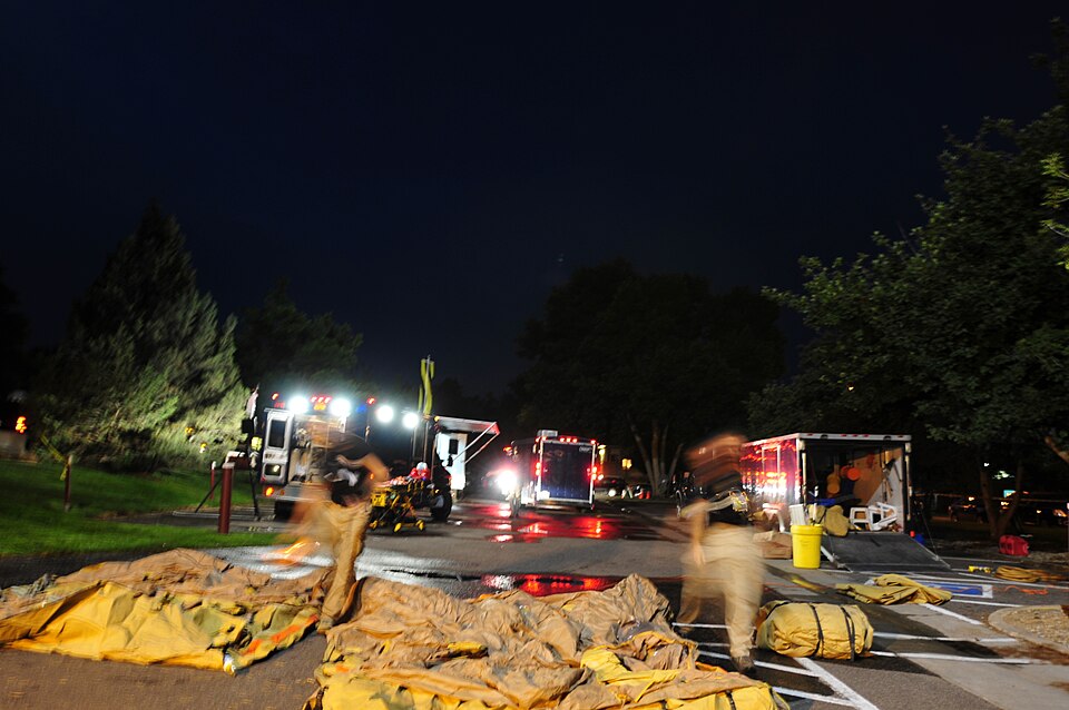 U.S. soldiers and airmen of the 8th Civil Support Team, Colorado National Guard, set up equipment outside the Boettcher West building at Denver University where DU Security discovered notional suspicious lab activity while searching the structure for simulated tornado damage during Exercise Vigilant