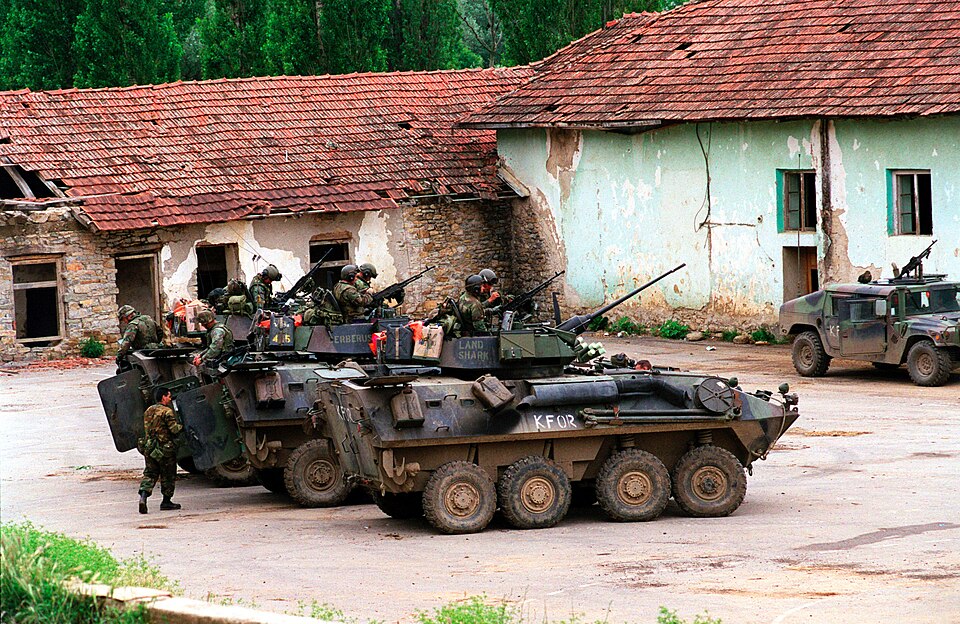 Marines from the 2nd Light Armored Reconnaissance Battalion prepare for an urban patrol aboard their Light Armored Vehicles (LAV-25) in the village of Zegra, Kosovo, on June 27, 1999. Elements of the 26th Marine Expeditionary Unit are deployed from ships of the USS Kearsarge Amphibious Ready Group a