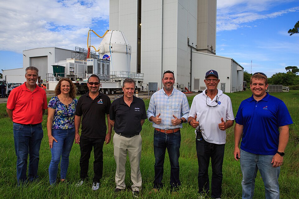 Teams from Kennedy’s Exploration Ground Systems and contractor Jacobs pose as the Orion spacecraft for the Artemis I mission is transported to the Florida spaceport’s Launch Abort System Facility on July 10, 2021. They will integrate components of the launch abort system onto the spacecraft. Launchi