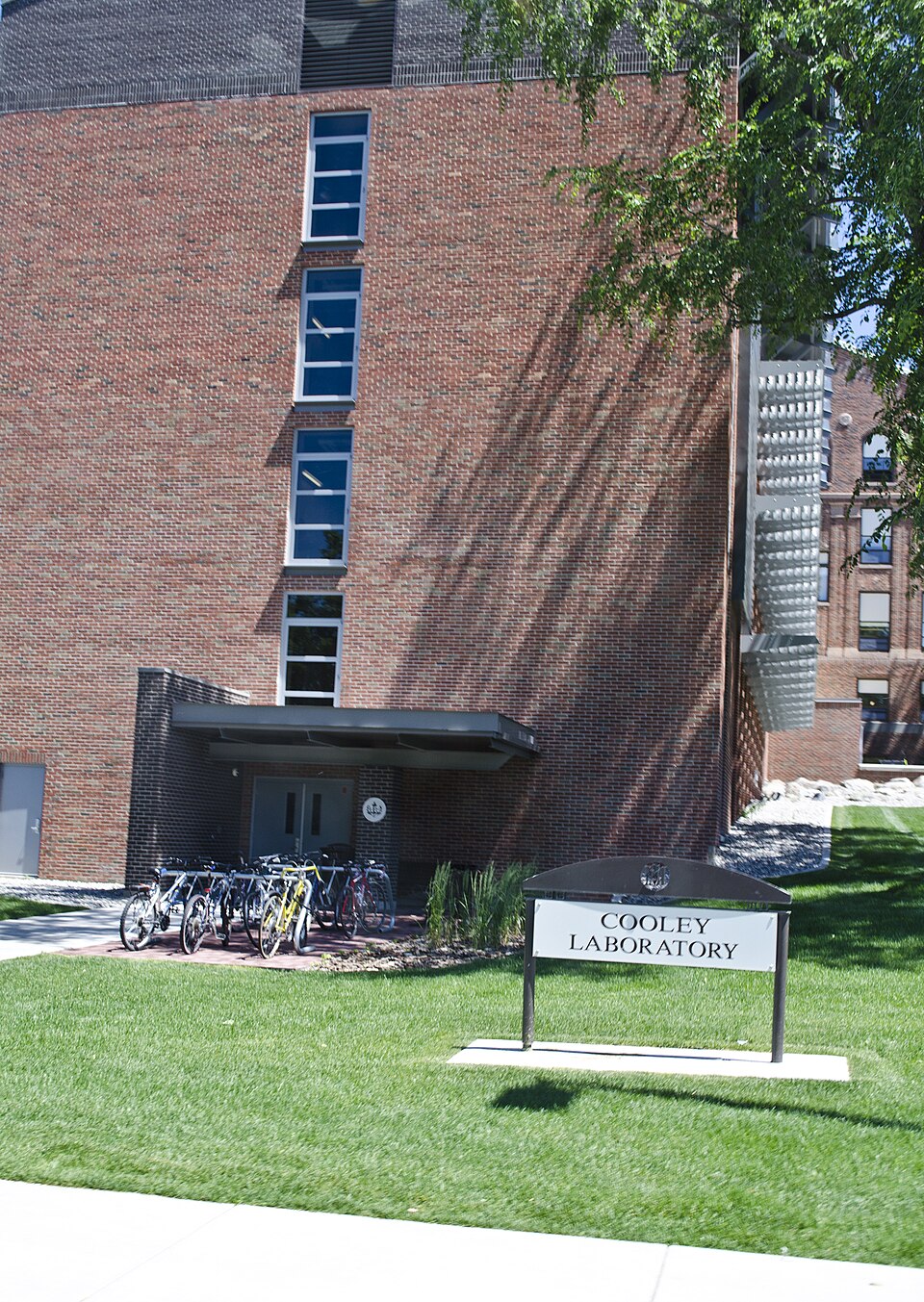 Looking west obliquely at Cooley Laboratory on the campus of Montana State University in Bozeman, Montana. The new sunscreens protecting the building can be see along the right-hand side.
Originally known as the the Medical Science Research Building, the structure was designed in 1953 by Sigvald Ber
