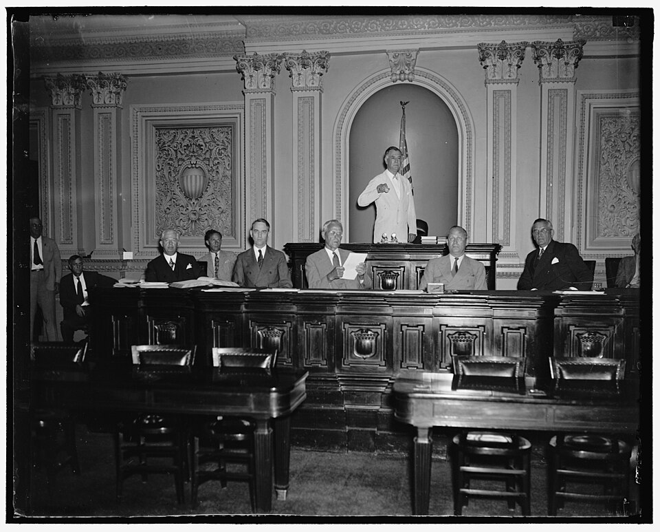 Title: Will run senate machine while Vice President Garner is absent. Washington, D.C. June 14. While Vice President Garner is vacationing in Texas during the next few weeks, Senator Key Pittman, President Pro Tem will preside over the Senate. Senator Pittman is shown with other officers of the Sena