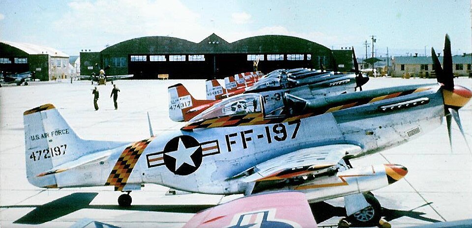 Lineup of the North American F-51D-25-NA Mustangs, sn. 44-72197 / FF-197, 44-74317 / FF-317, 44-84857 / FF-857 together with 7-8 other unidentified Mustangs from the 192nd Fighter-Bomber Squadron, on the 131st Fighter-Bomber Group (FBG) ramp at George AFB, Victorville, California, during August of 1