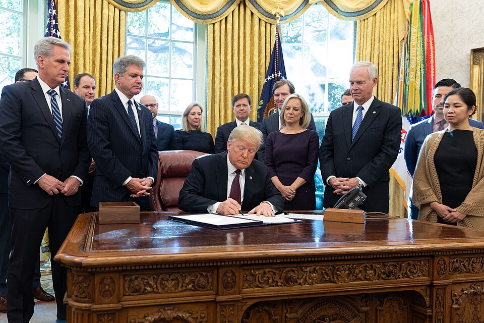 President Donald J. Trump signs the Cybersecurity and Infrastructure Security Agency Act Friday, Nov. 16, 2018, in the Oval Office of the White House.  (Official White House Photo by Joyce N. Boghosian)