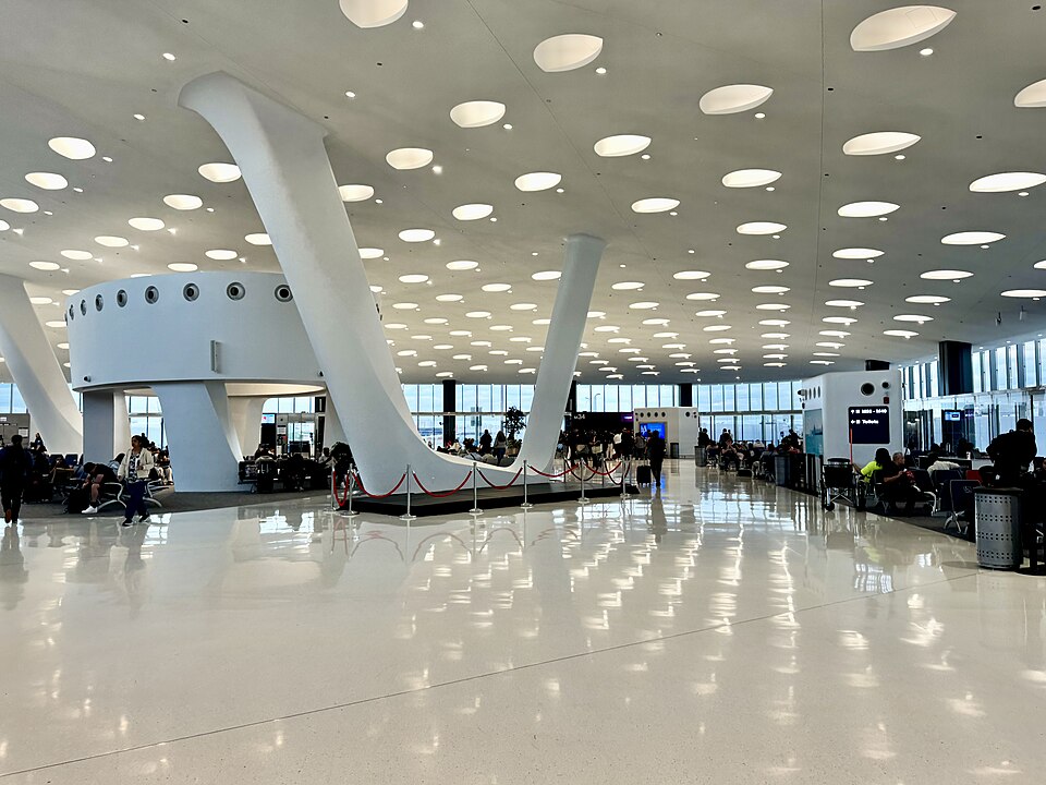 Built in 1989-1993, this Contemporary and Postmodern-style building was designed by Ralph Johnson of Perkins + Will Architects to serve as an international terminal for Chicago O’Hare International Airport, replacing the former International Terminal within the original Terminal 1.  The building was