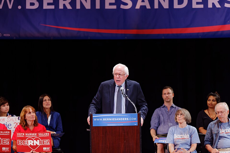 Outside of the Town Hall theater on West 43rd Street in Manhattan, a crowd of smiling and optimistic people Friday overflowed into the one-way street. Delivery trucks and yellow taxi cabs creeped by, their engines engaged in a shouting match with Bennet Weiss, a man who bore a fleeting resemblance t