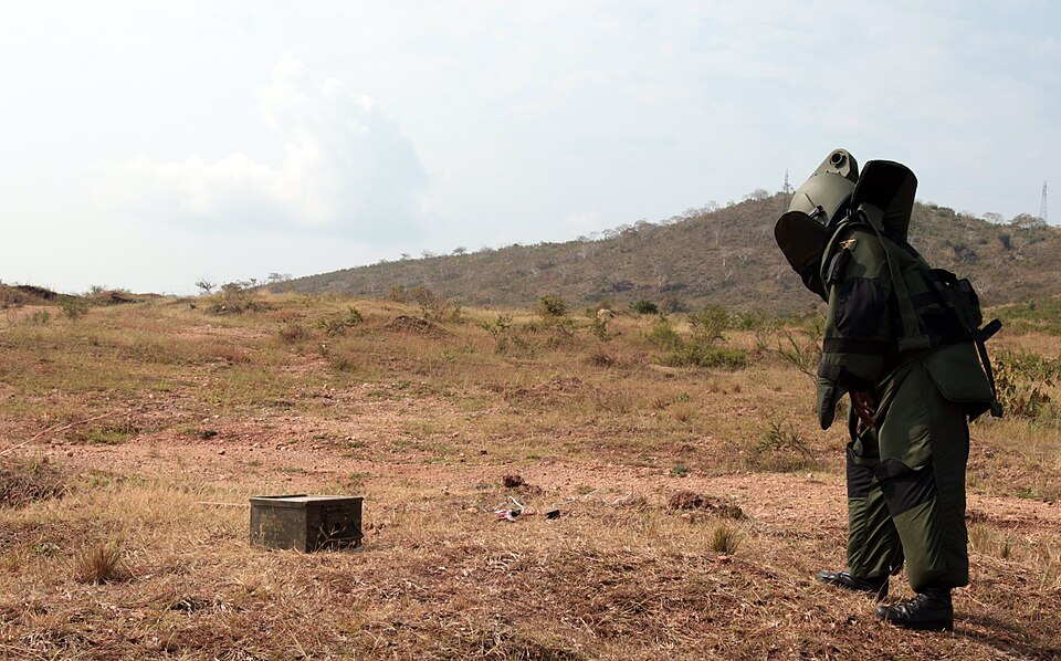 An explosive ordinance disposal soldier with 1st Sapper Company, Burundi National Defense Force, approaches a simulated improvised explosive device during a combined arms breaching exercise, June 26, 2012. Marines and sailors from Special-Purpose Marine Air-Ground Task Force Africa, Security Coopera